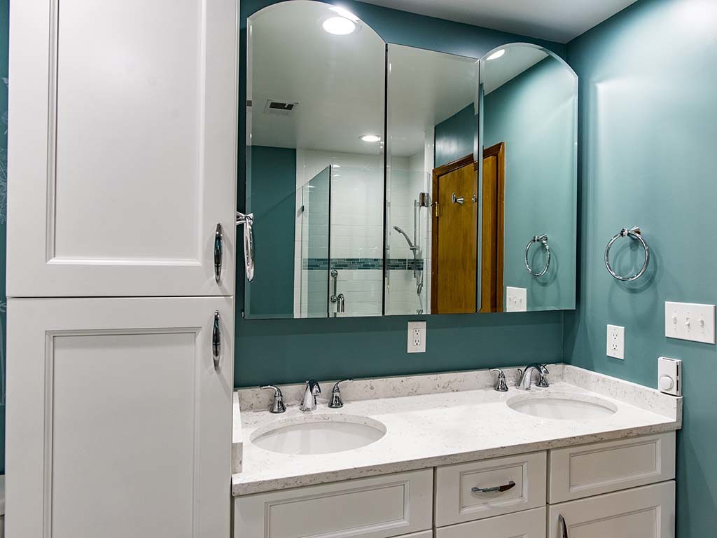 Green bathroom in Rockville MD with double sink vanity