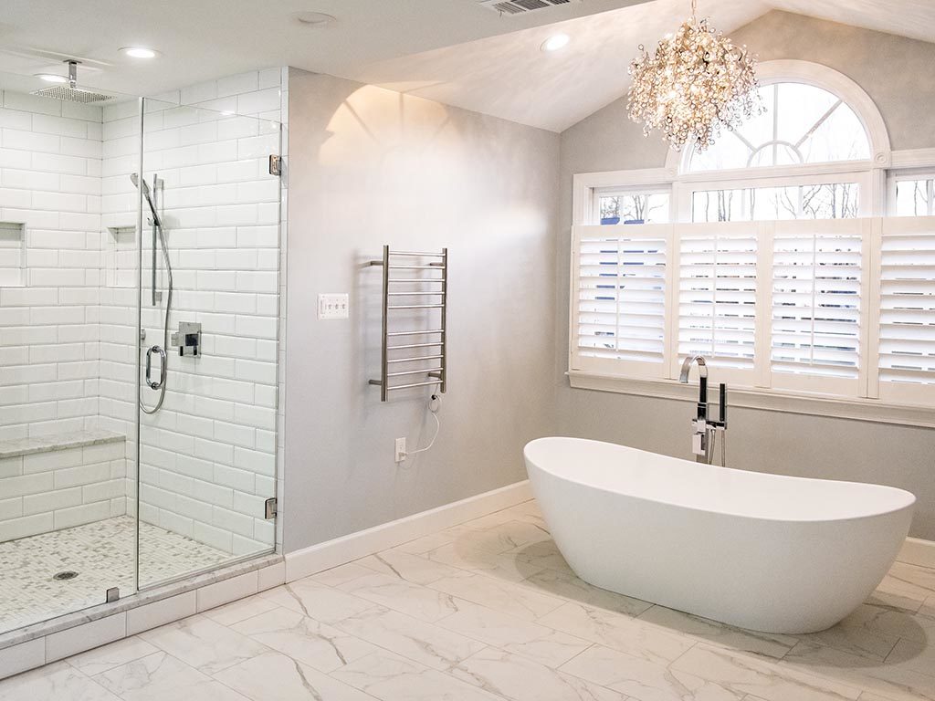 Spacious, elegant bathroom project in Columbia MD with shower and a bath tub