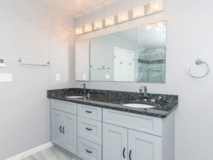 Light grey bathroom with double sink shaker vanity