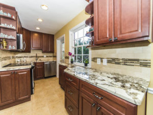 Traditional kitchen with brown cabinets and granite countertop