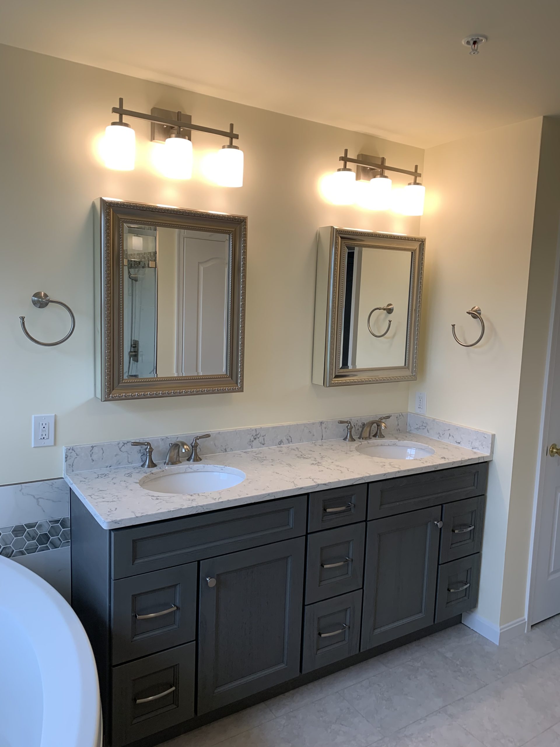 Elegant bathroom with double sink dark brown vanity