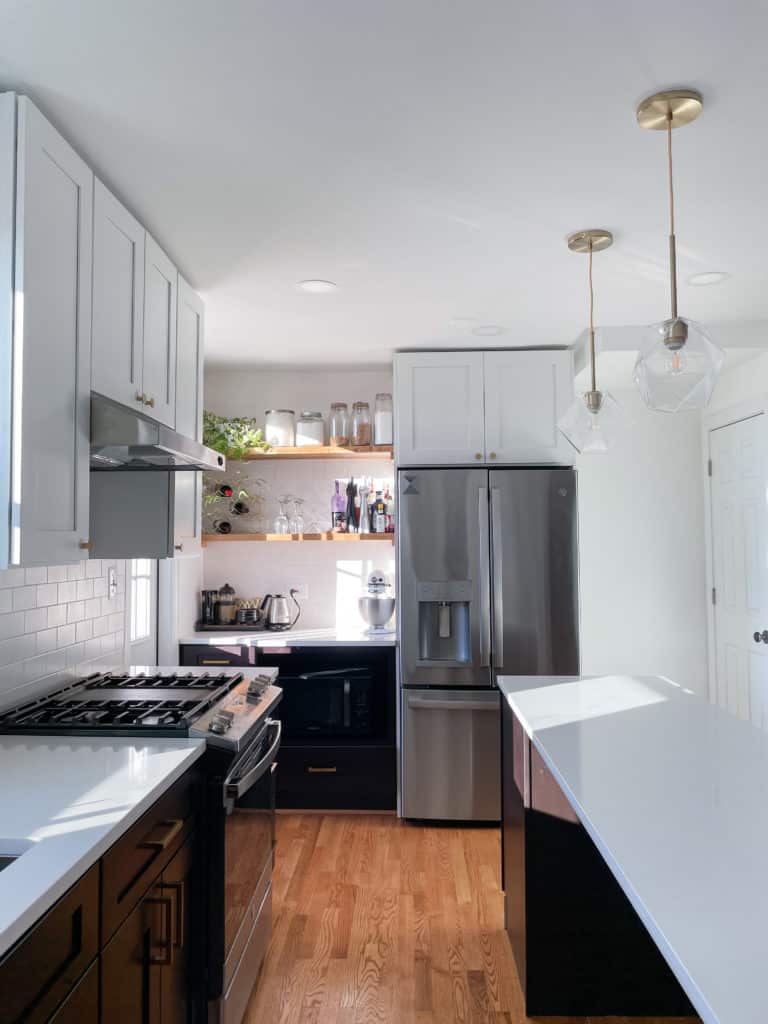 Small kitchen style with white and dark brown shaker cabinets, and white countertop