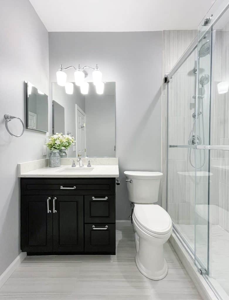 Bathroom project in Annapolis MD with black vanity, toilet and a shower