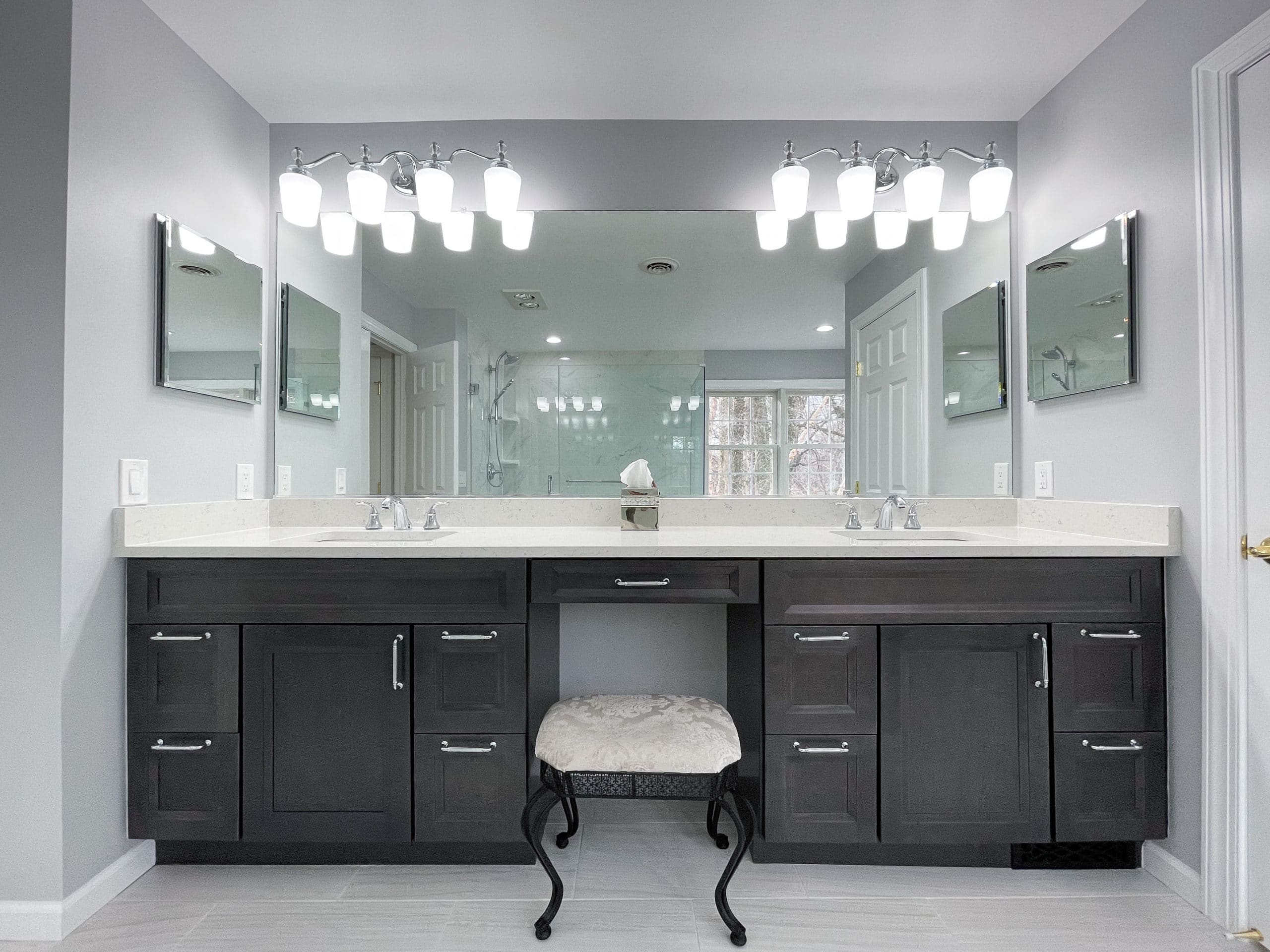 Light grey bathroom with dark brown double sink vanity