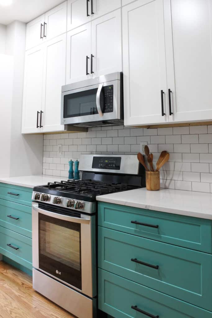 Small kitchen project with white and teal shaker cabinets