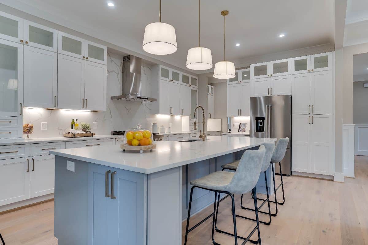 Stylish kitchen with white shaker cabinets and white countertop