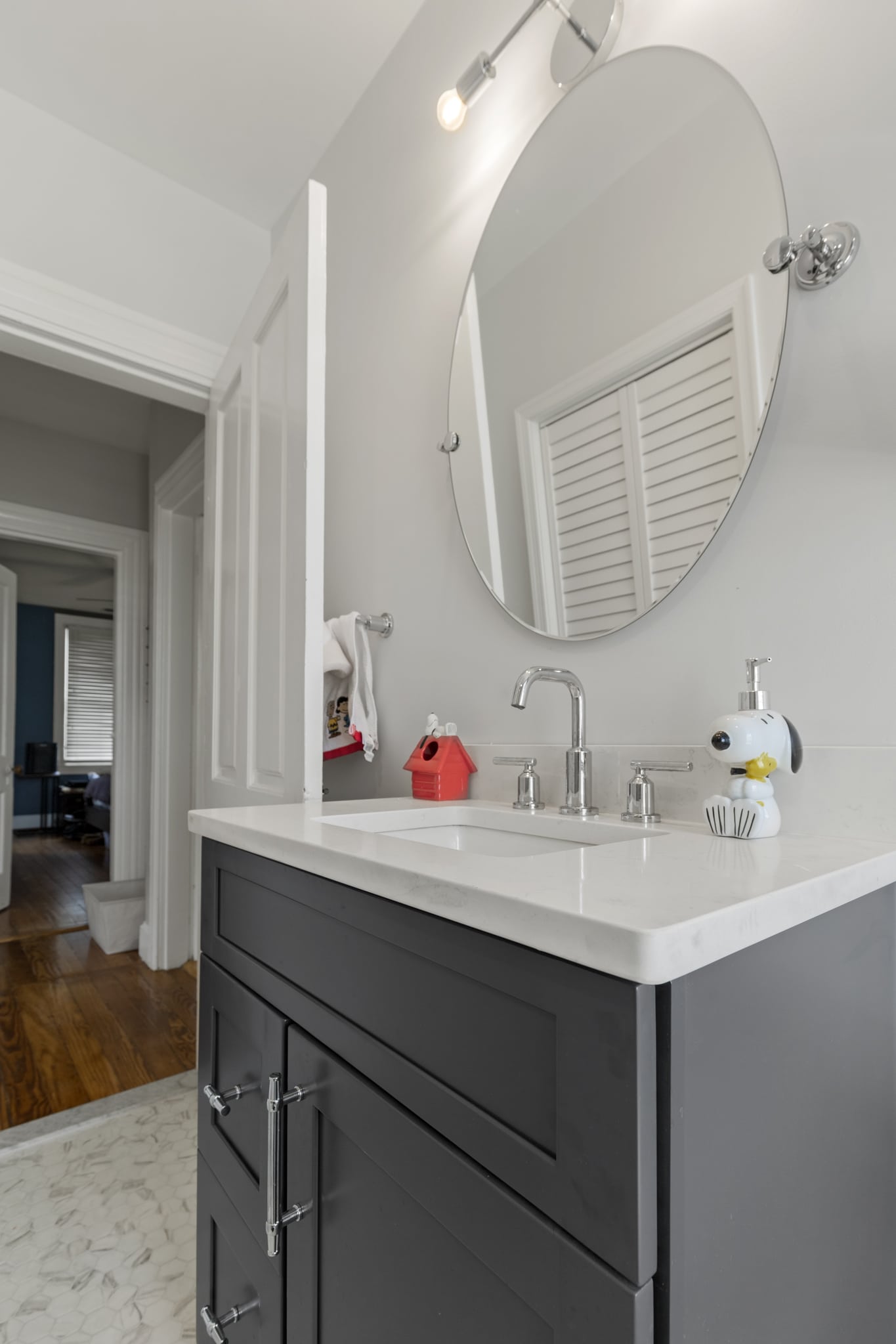 Small bathroom with Gray vanity, and a toilet
