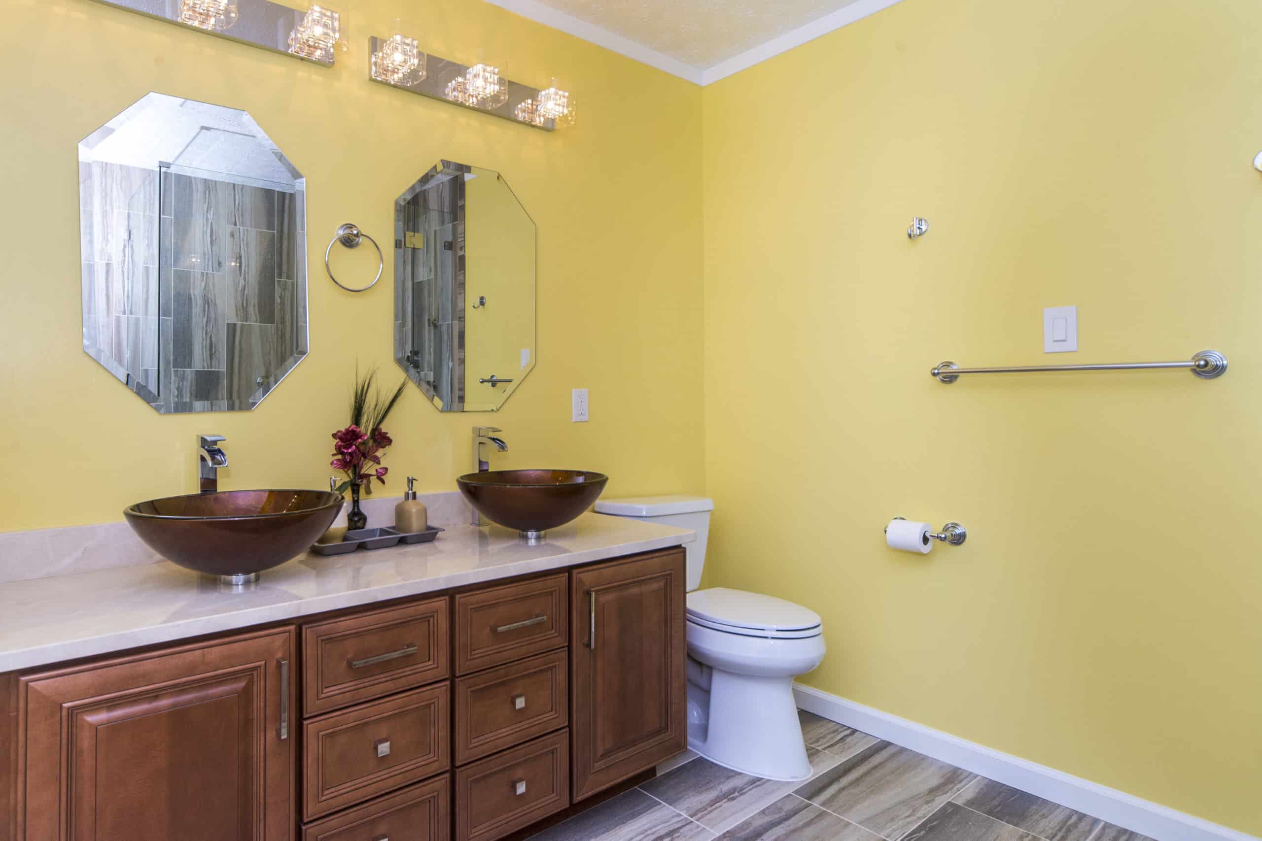 Spacious bathroom with wood colored flooring, and brown vanity