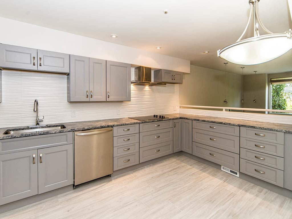 Spacious kitchen with grey shaker cabinets