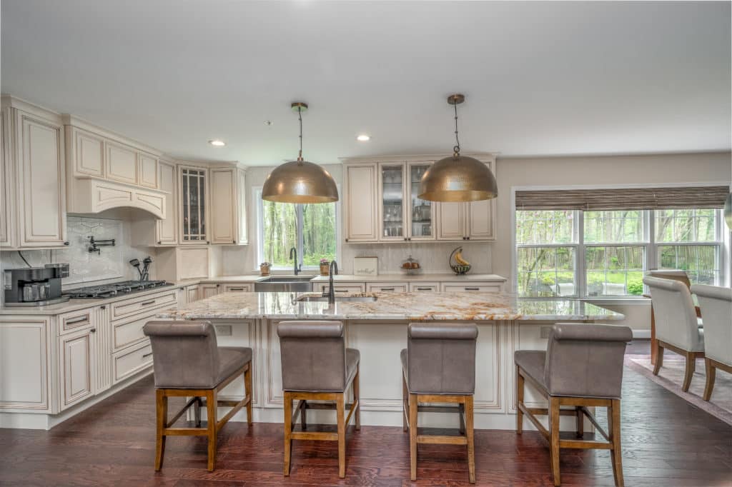 Luxury, traditional kitchen style with cream cabinets and granite countertop