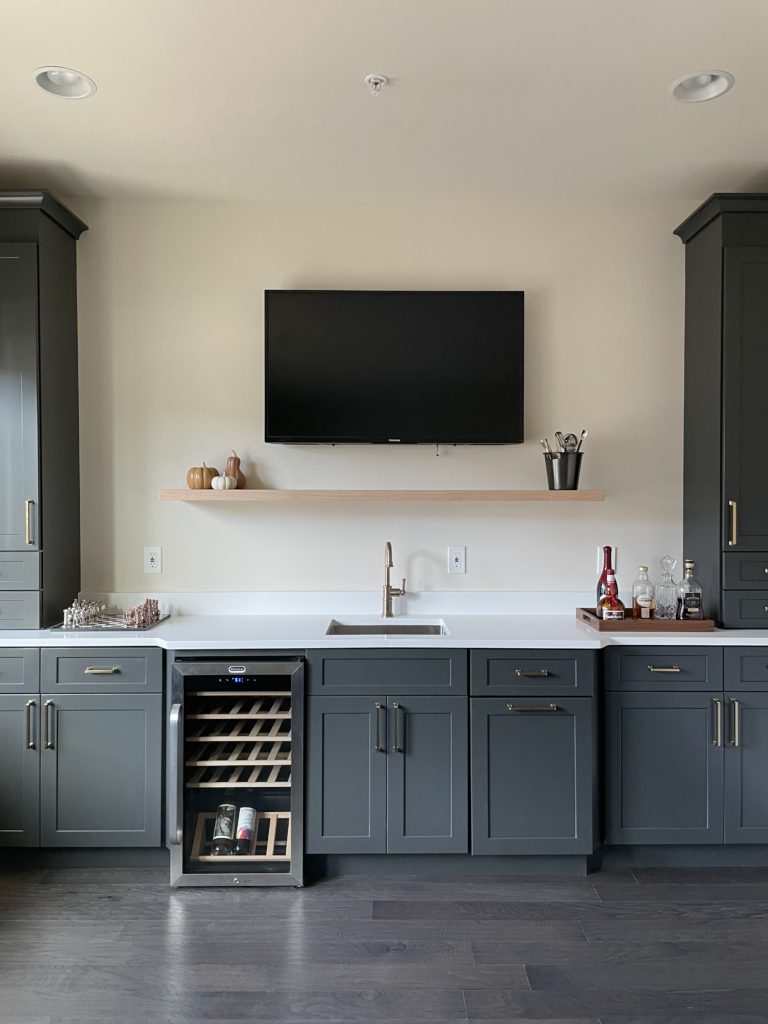 Clean, sleek kitchen project with dark gray shaker cabinets