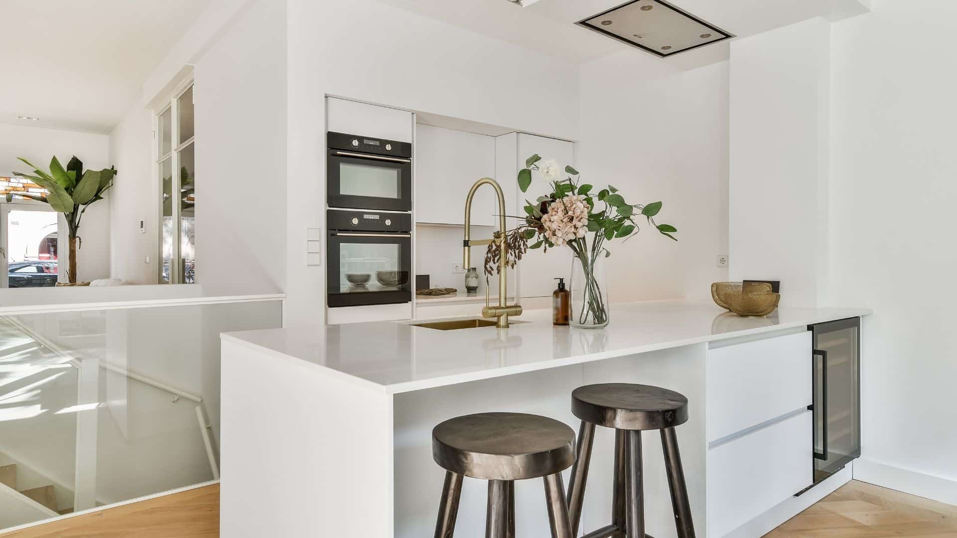 Small white kitchen with white countertop