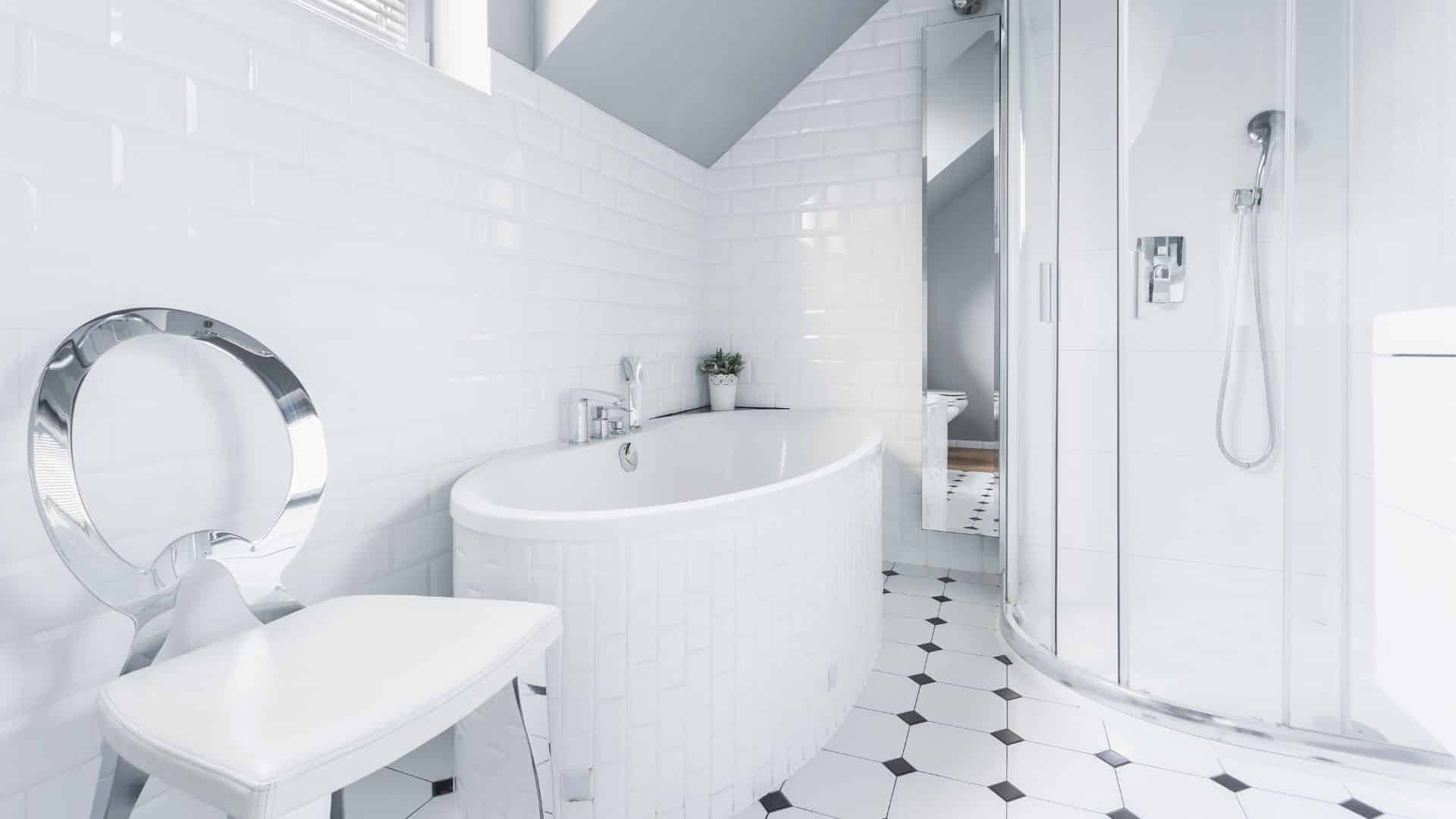 White clean bathroom with tub, and shower