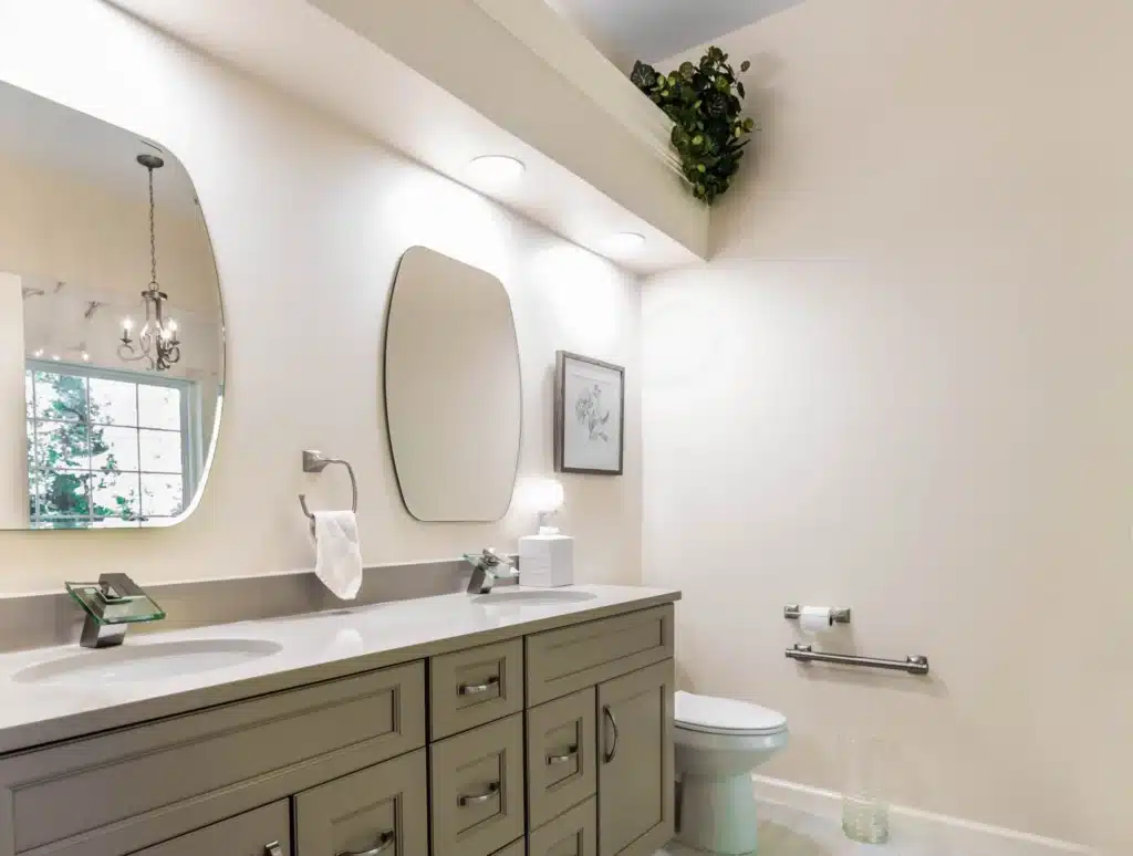 Elegant bathroom project with taupe double sink vanity and a toilet