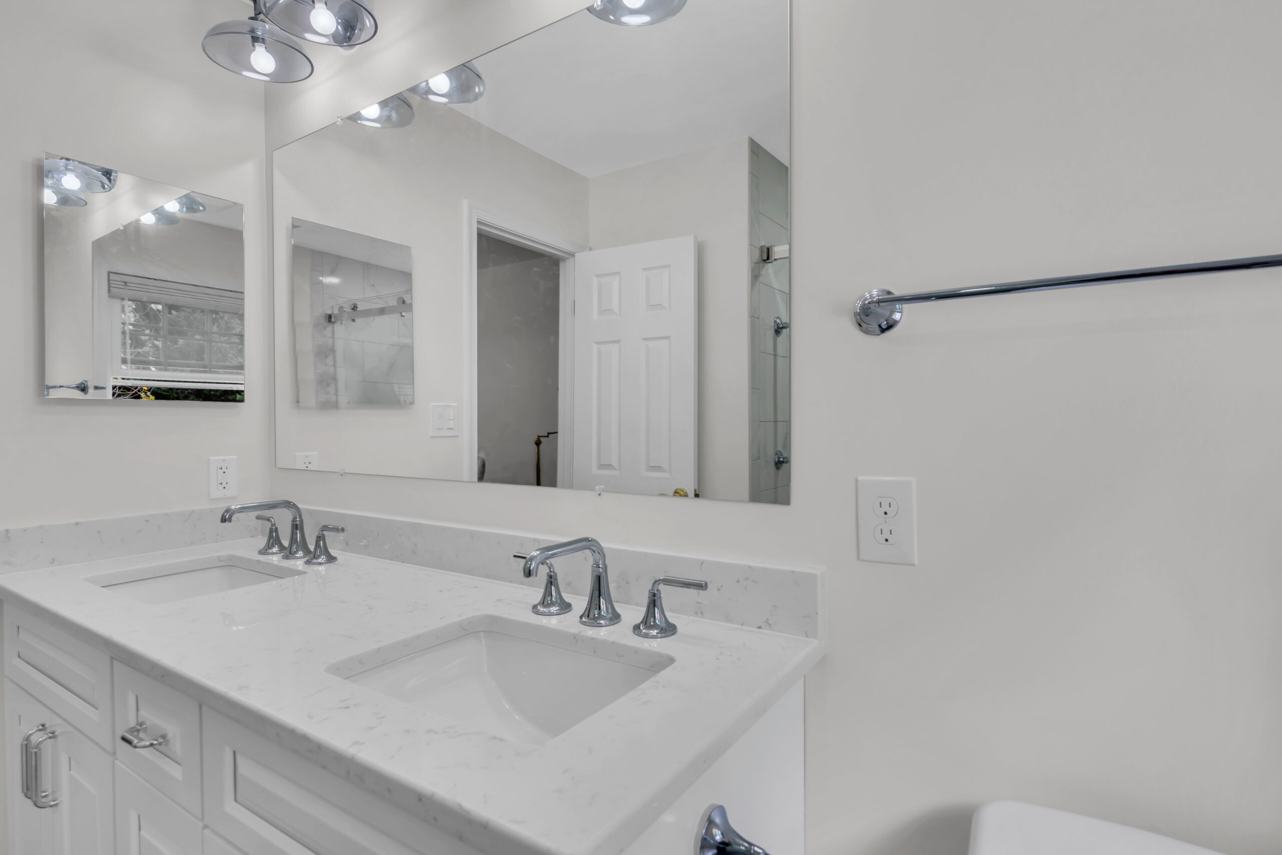 White bathroom with double-sink vanity