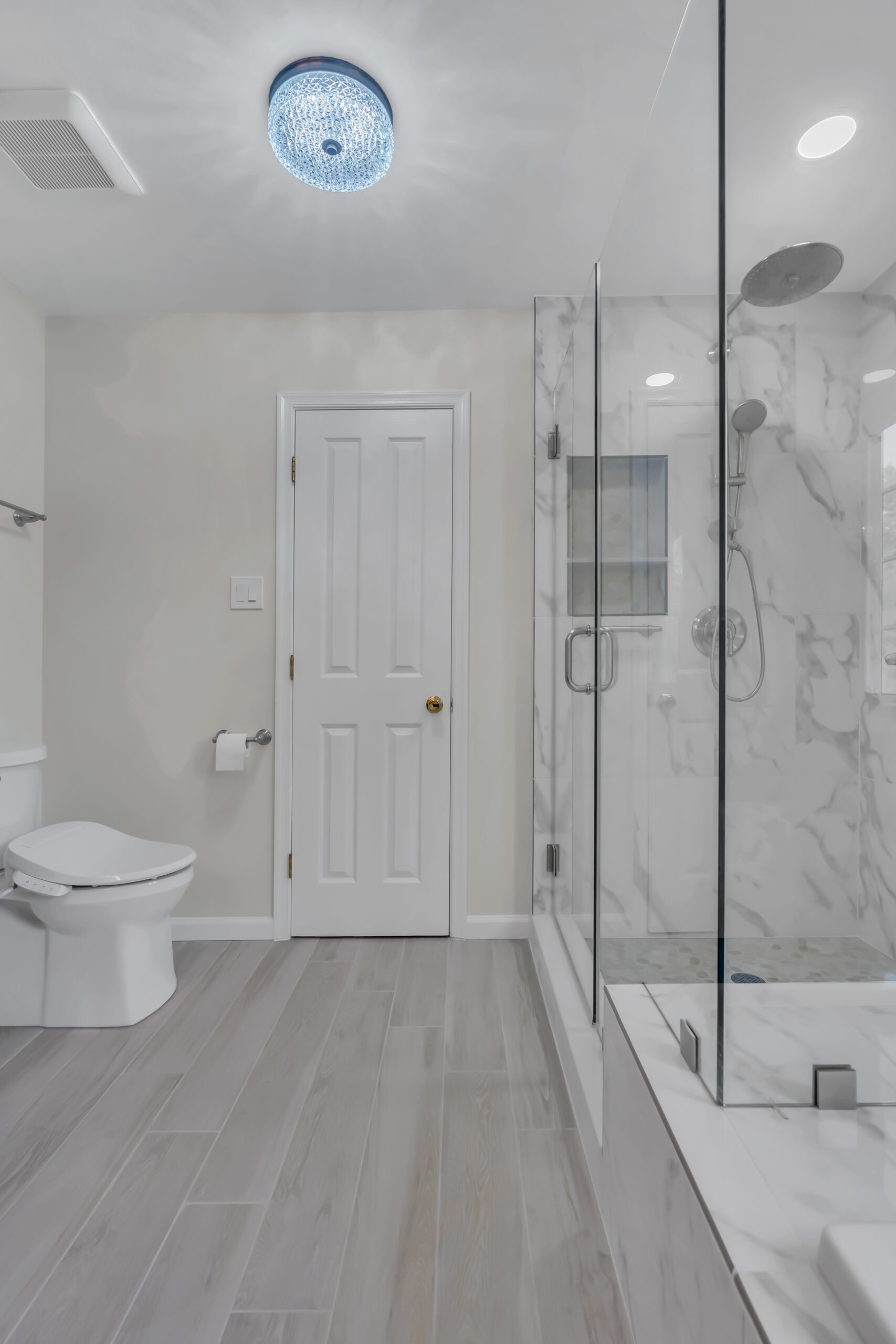 Spacious, luxury bathroom style with bath tub and a shower