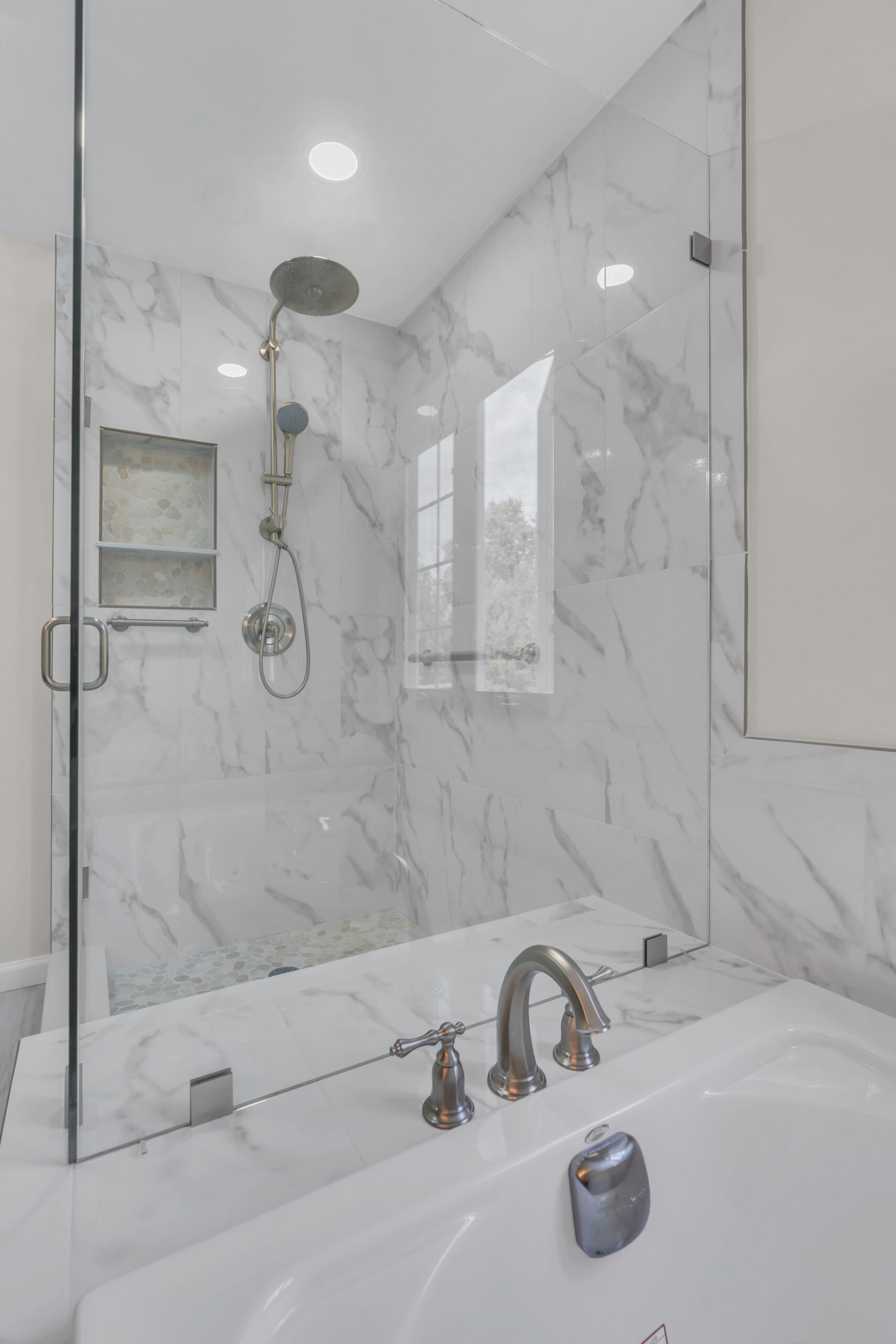 Spacious, luxury bathroom style with bath tub and a shower