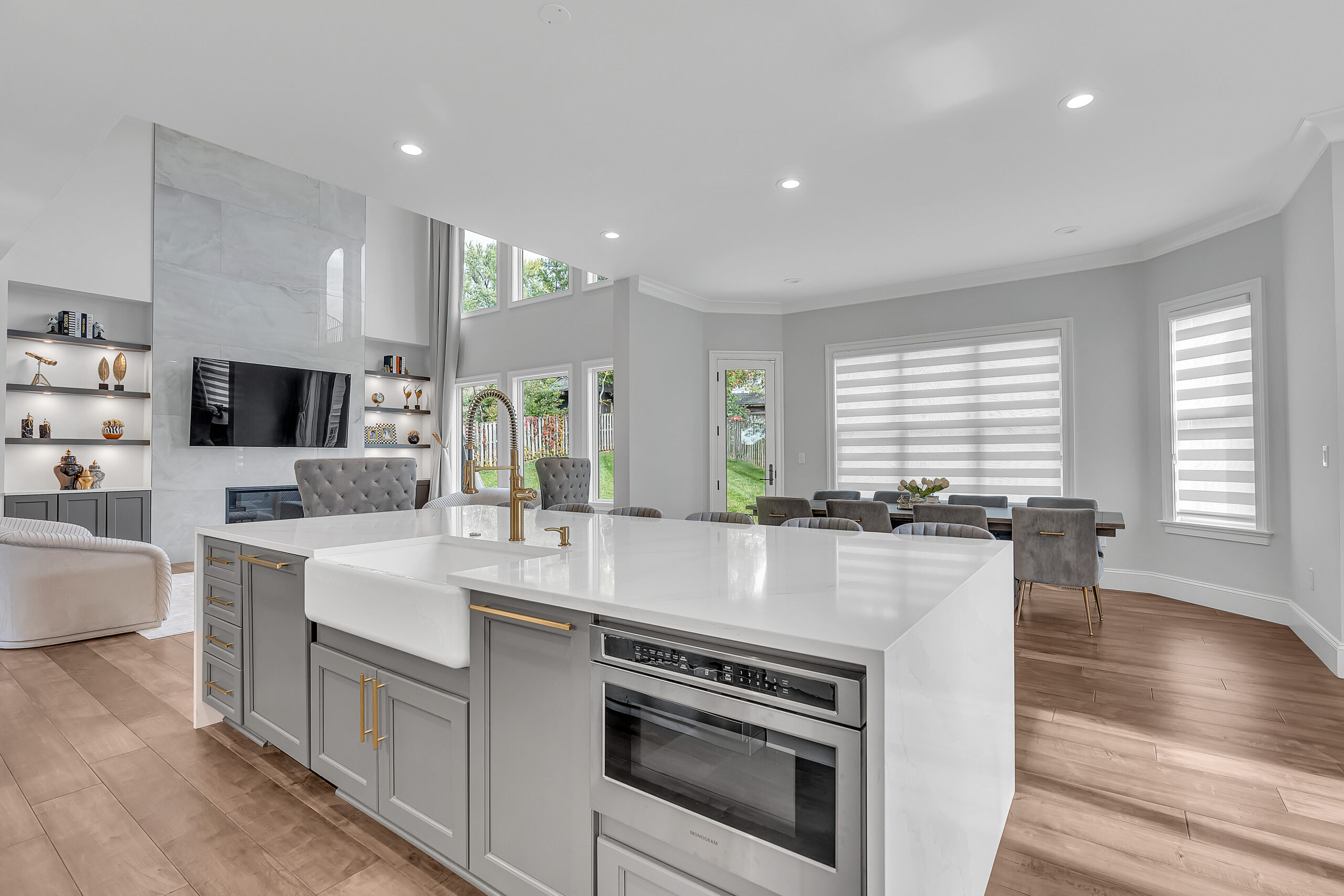 Elegant kitchen with white countertop, and gray cabinets