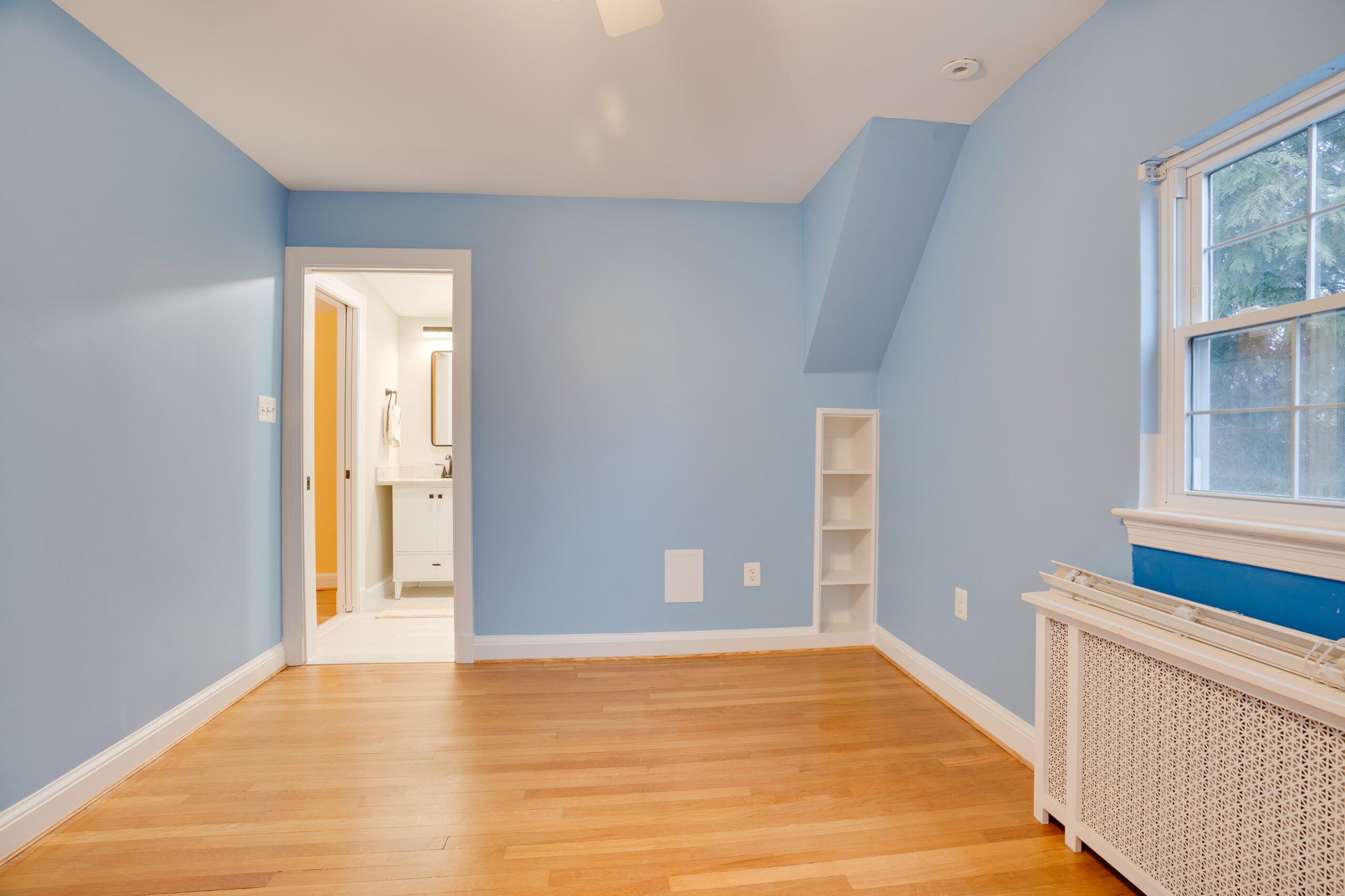 Room with blue paint, wood flooring
