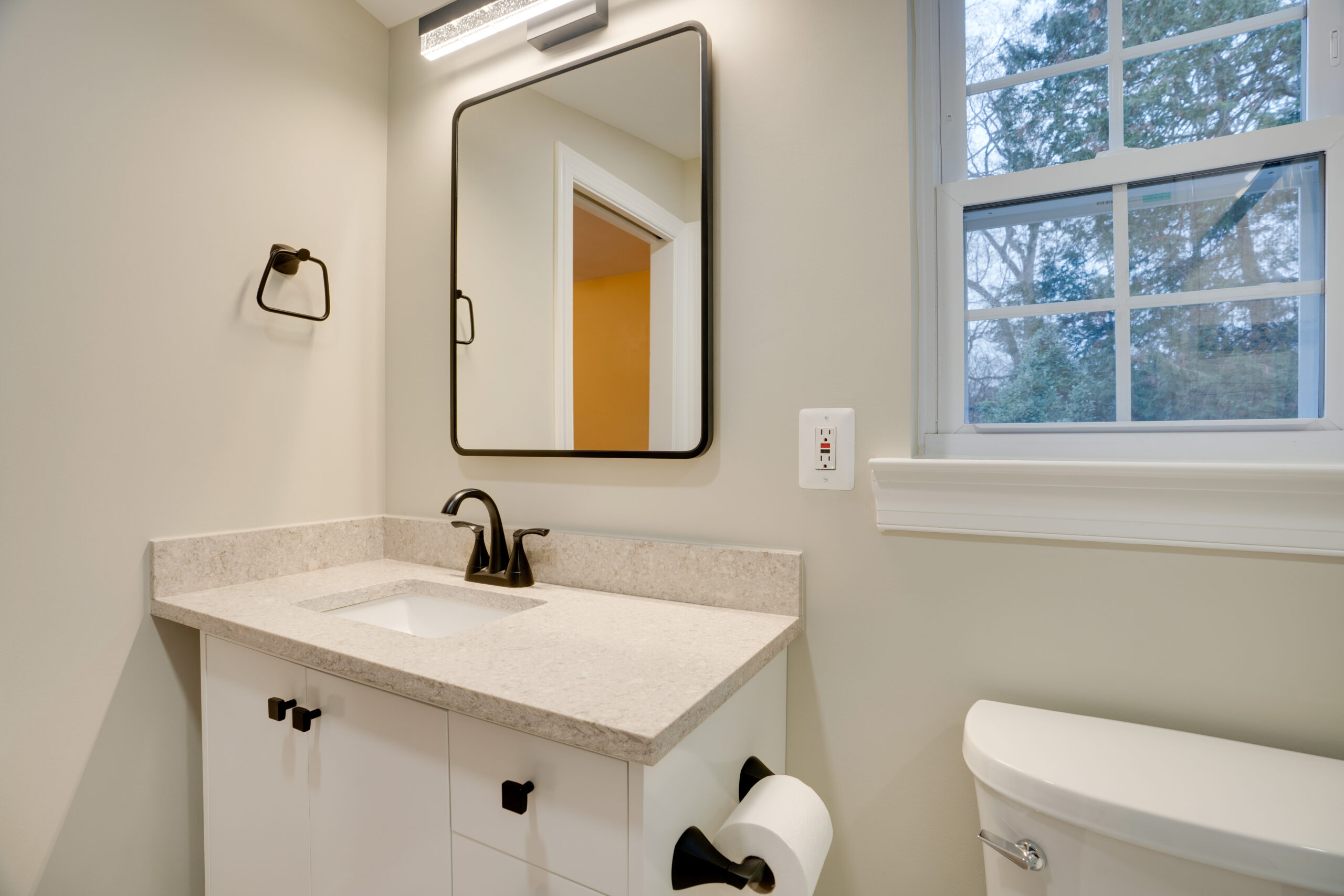 Bathroom with white cabinet and toilet