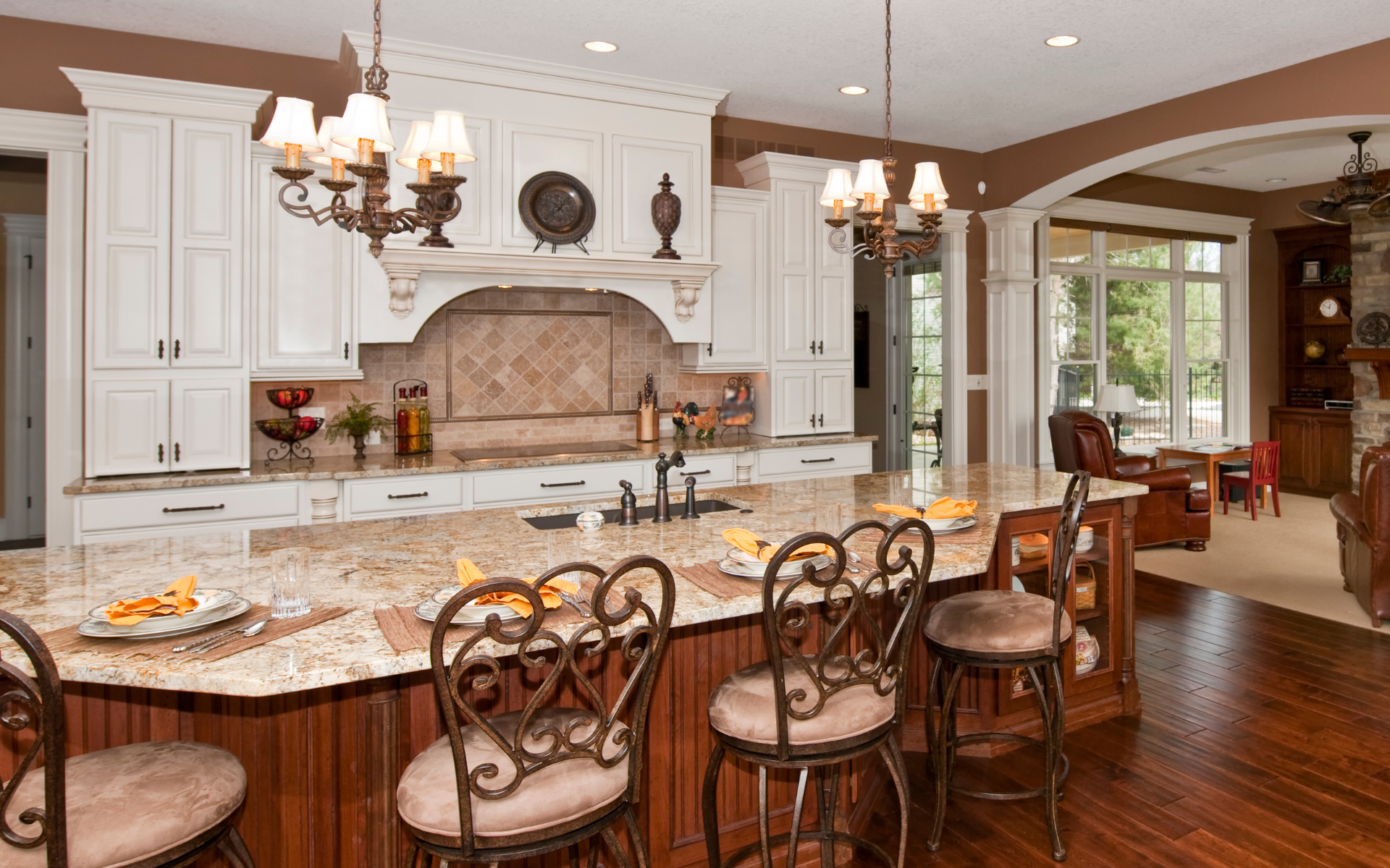 Traditional style kitchen with white cabinets with crown moldings
