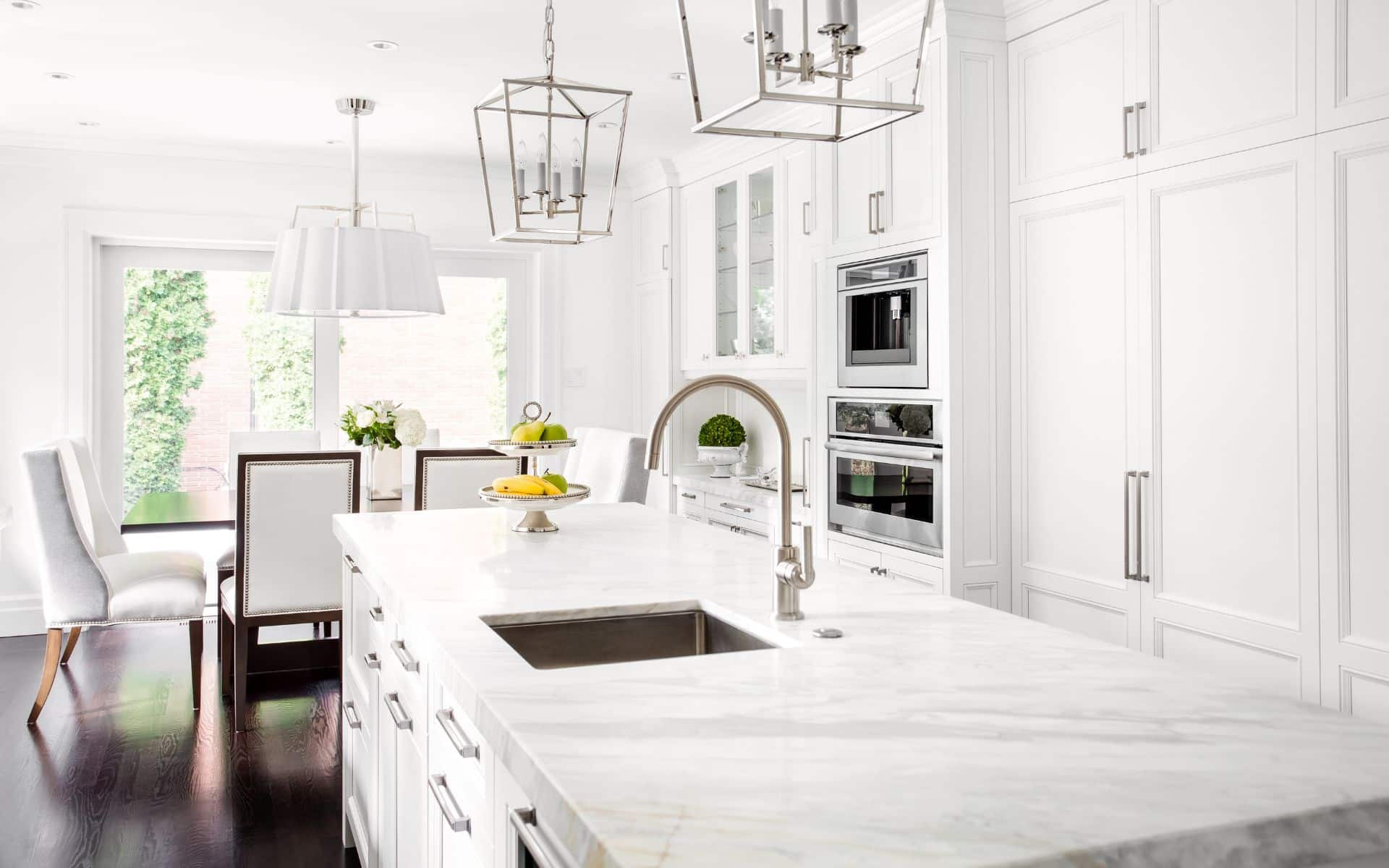 Bright white kitchen with white granite countertop
