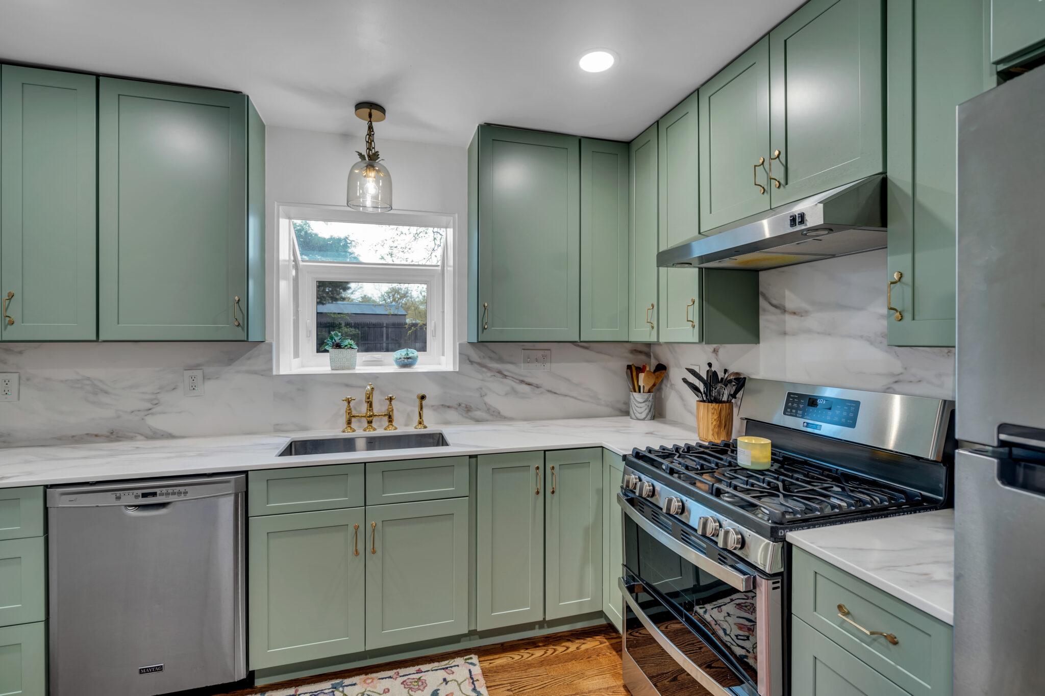 Modern Sage Kitchen Remodel by Mega Kitchen and Bath project photo