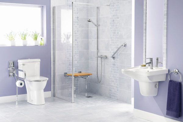 Lavander bathroom with toilet and shower for elder or disabled individual.