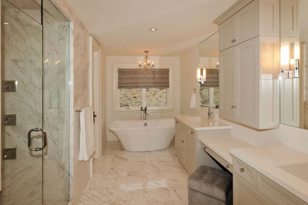 Spacious bathroom with tub, vanity, and shower