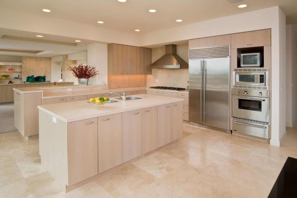 Spacious kitchen with beige cabinets and countertops