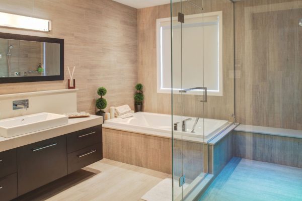 Brown bathroom with dark brown floating cabinets