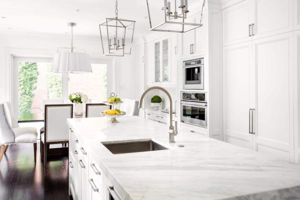 Bright white kitchen with white granite countertop
